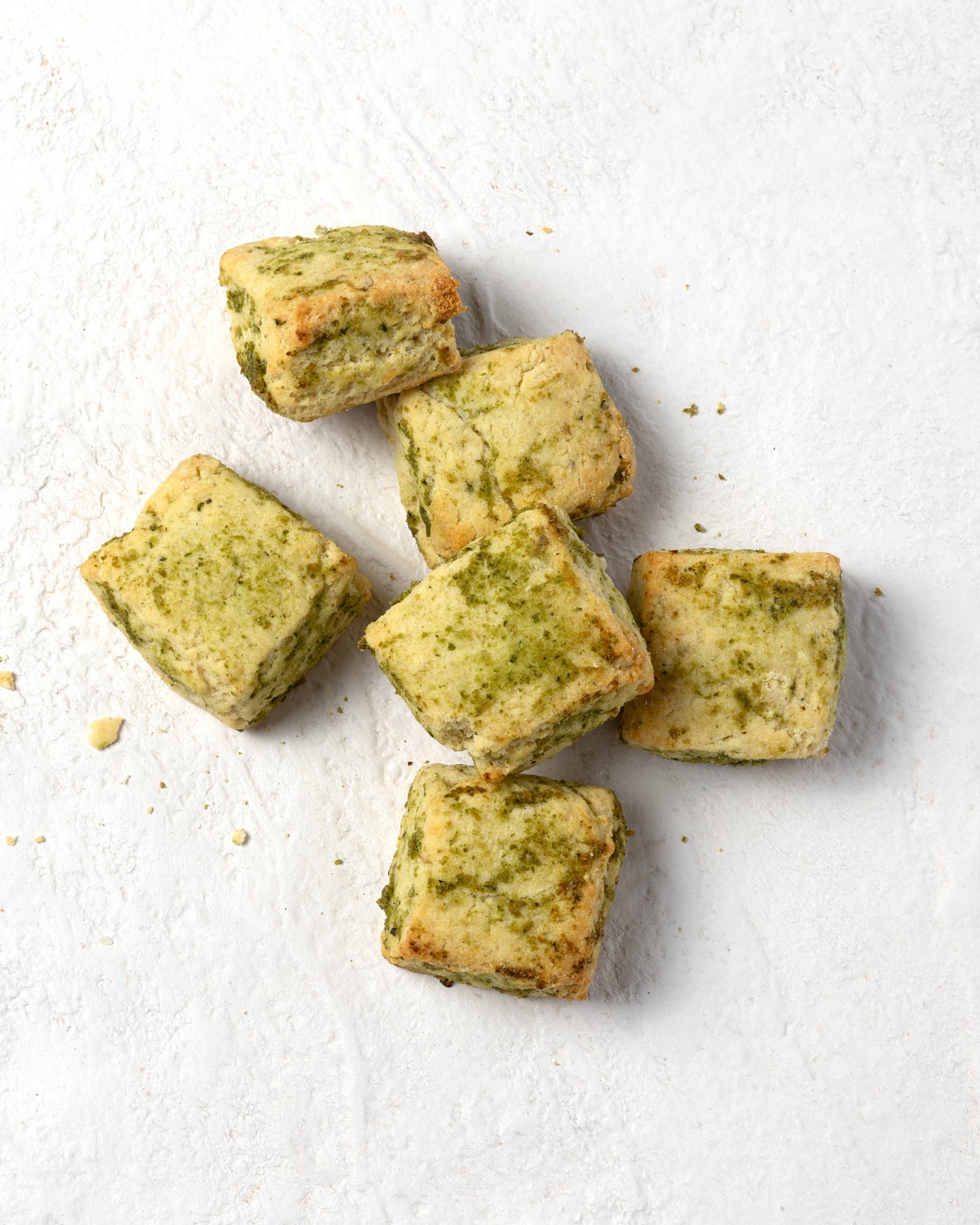 TruCrumb Pesto Biscuitini on a white surface